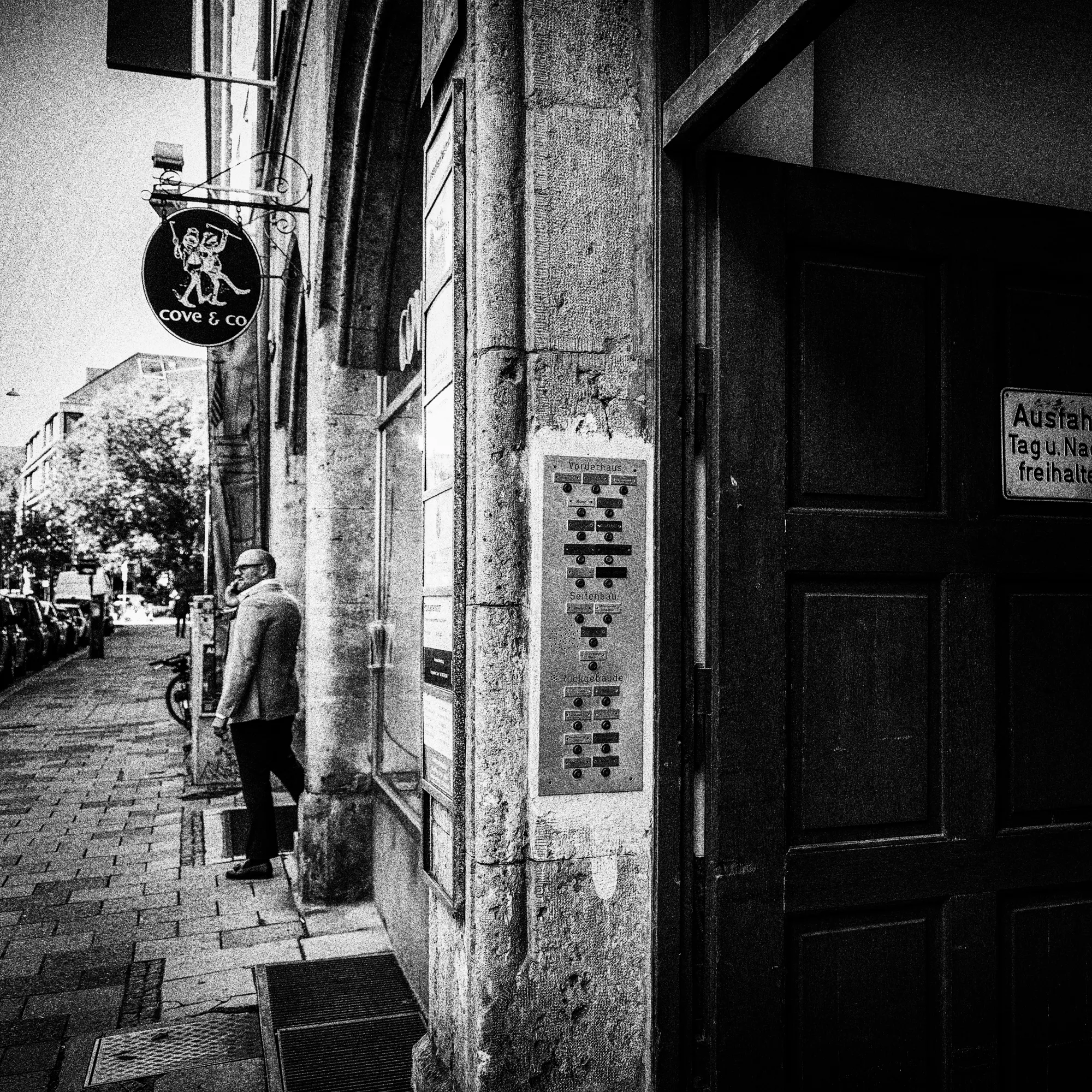 Manual Verification - A figure standing before a door, performing an on-site audit