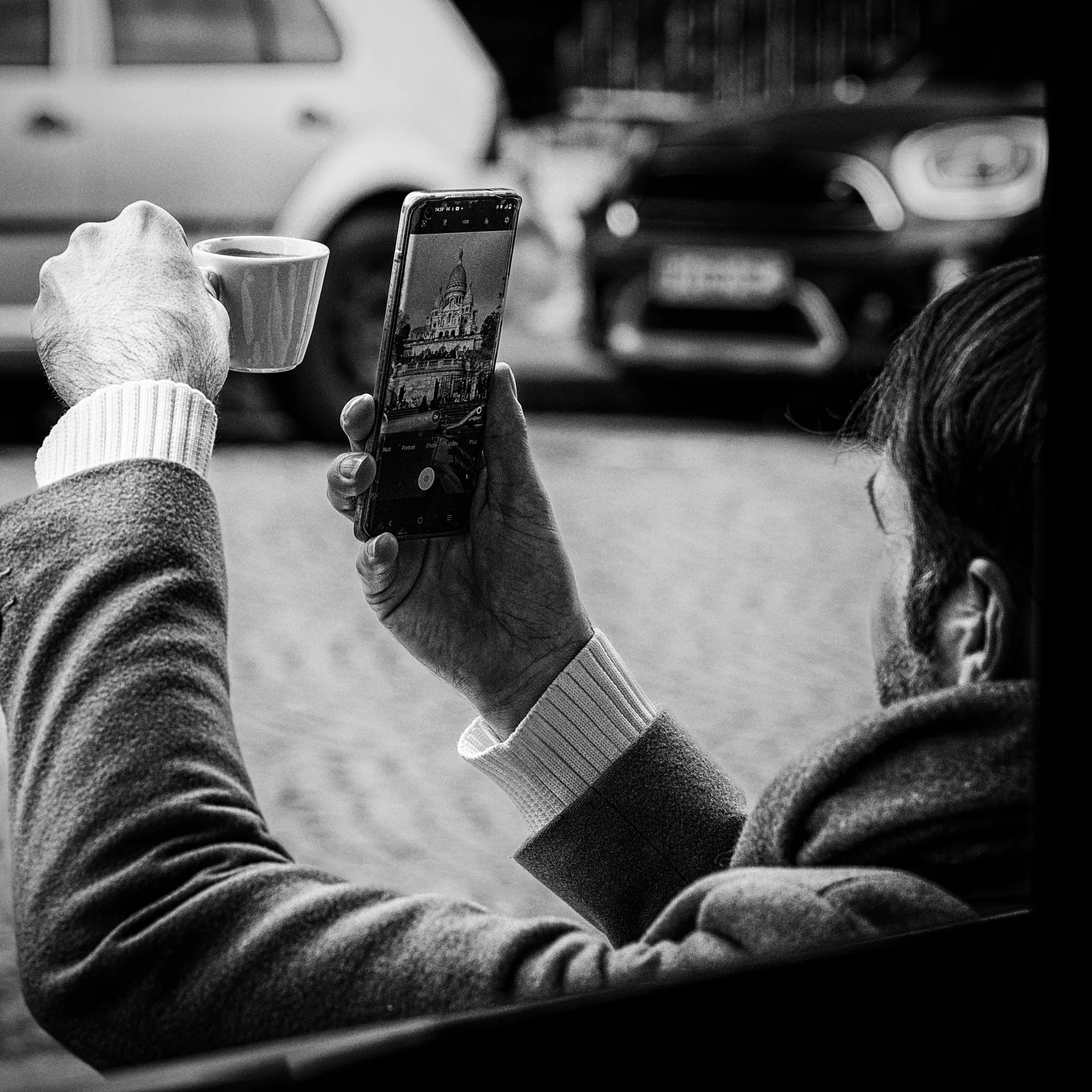 Interface Ritual - Reality buffered through a smartphone screen, neglecting the physical moment